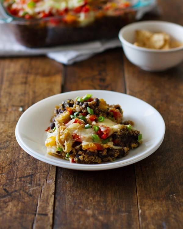 Quinoa and black bean casserole on a white plate.