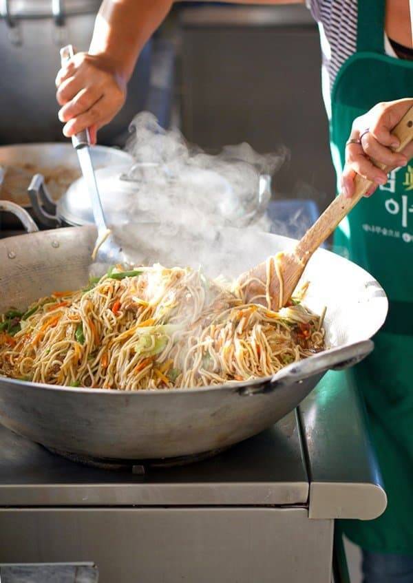 Filipino Pancit steaming in a pan.