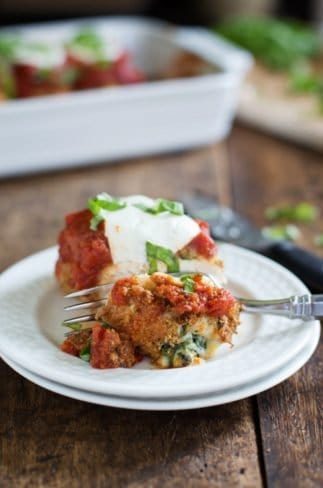 Baked Mozzarella Chicken Roll on plate with bite taken.