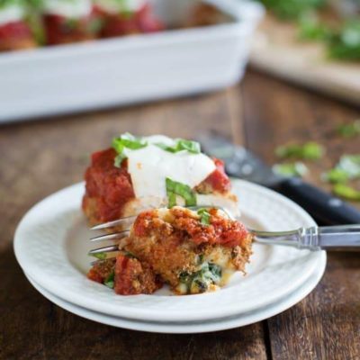 Baked Mozzarella Chicken Roll on plate with bite taken.