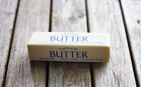 Butter on a wooden surface.