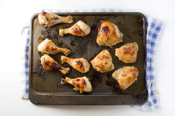 Chicken on a baking pan.