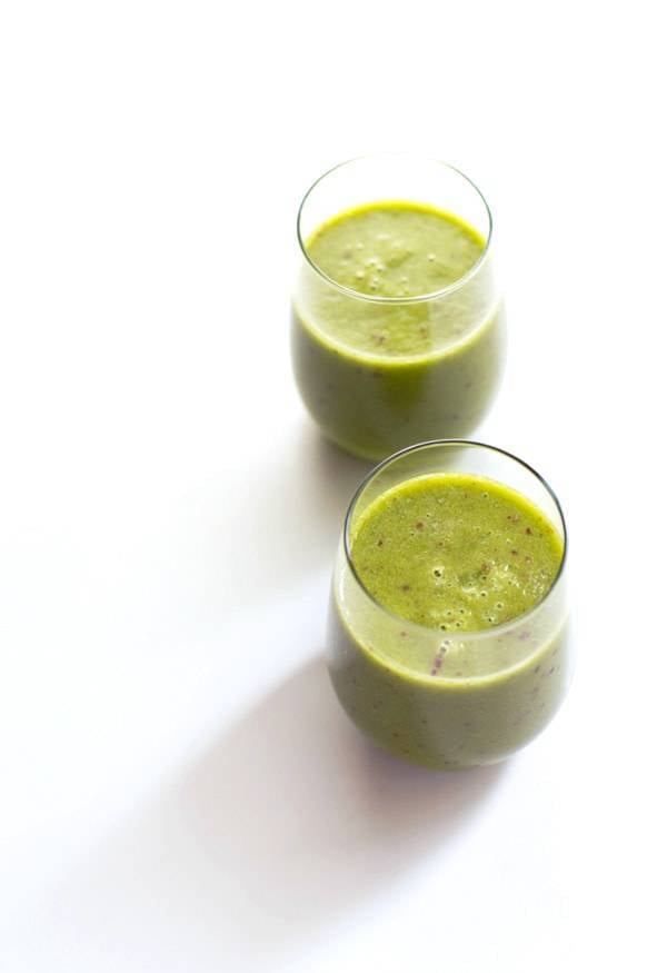 Peach green smoothies in glasses.