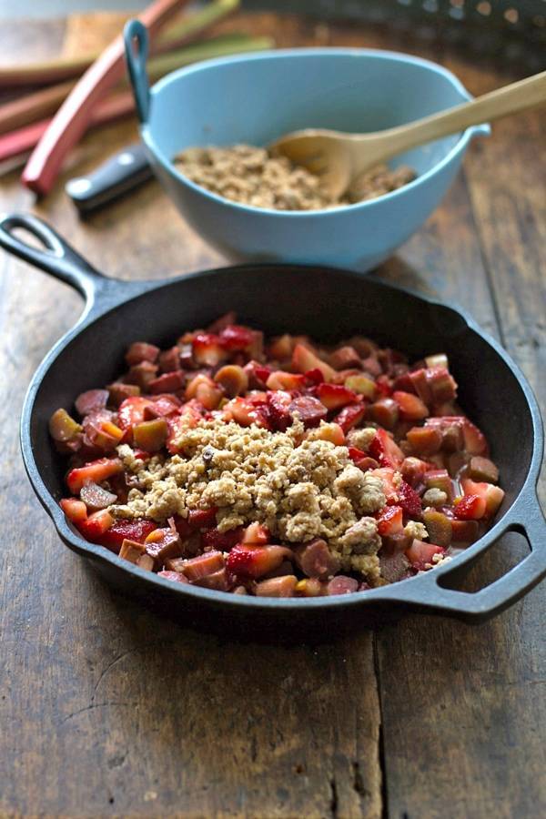 Paleo strawberry rhubarb crisp in a skillet.