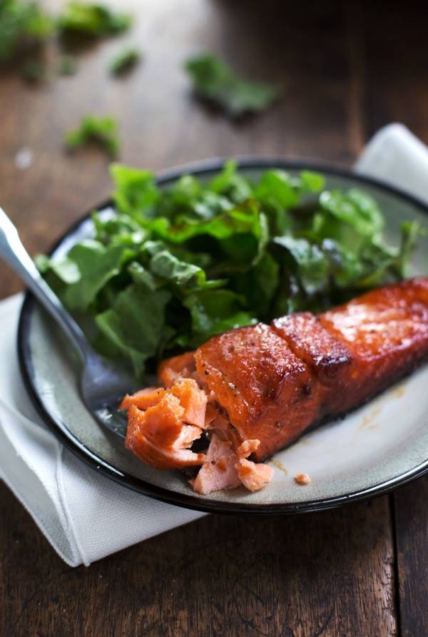 Caramelized salmon on a plate.