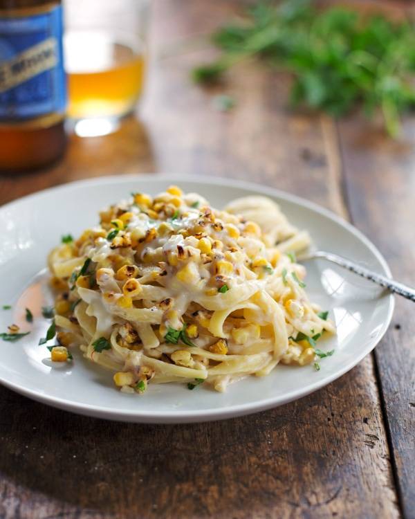 Chipotle sweet corn fettuccine on a white plate.