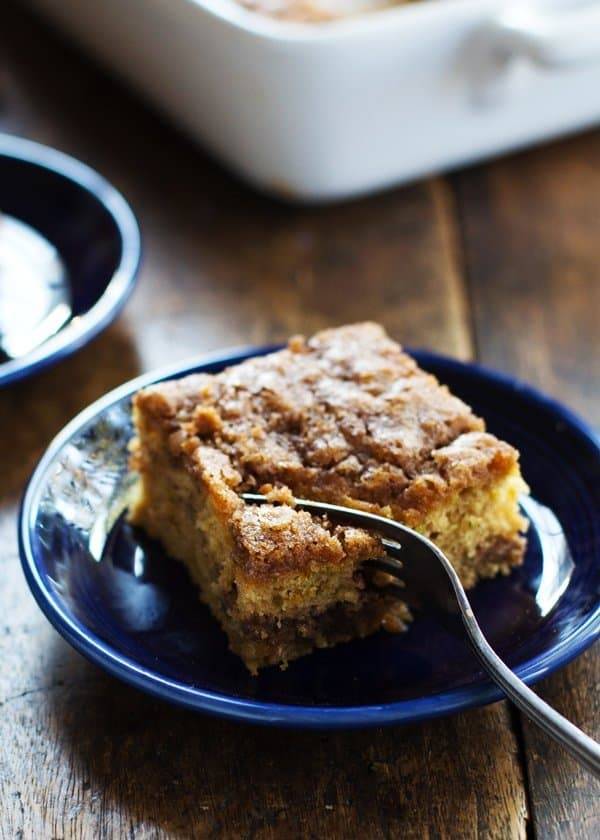 Cinnamon Sugar Zucchini Coffee Cake on a blue plate with a fork.