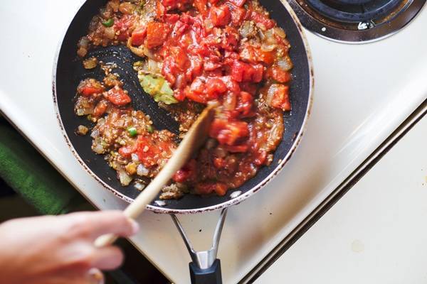 Food cooking in a skillet.