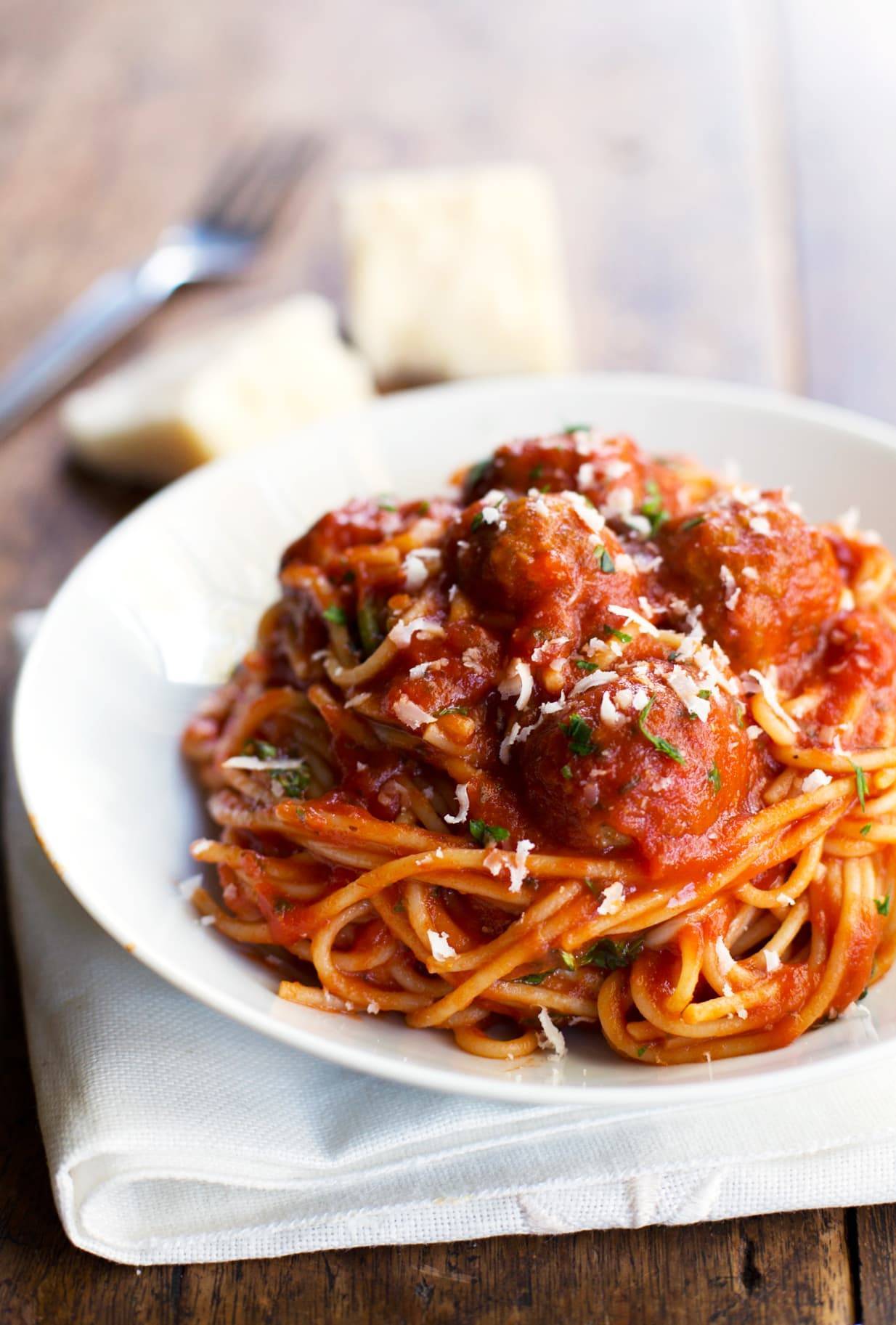 Spaghetti and Meatballs on a white plate.