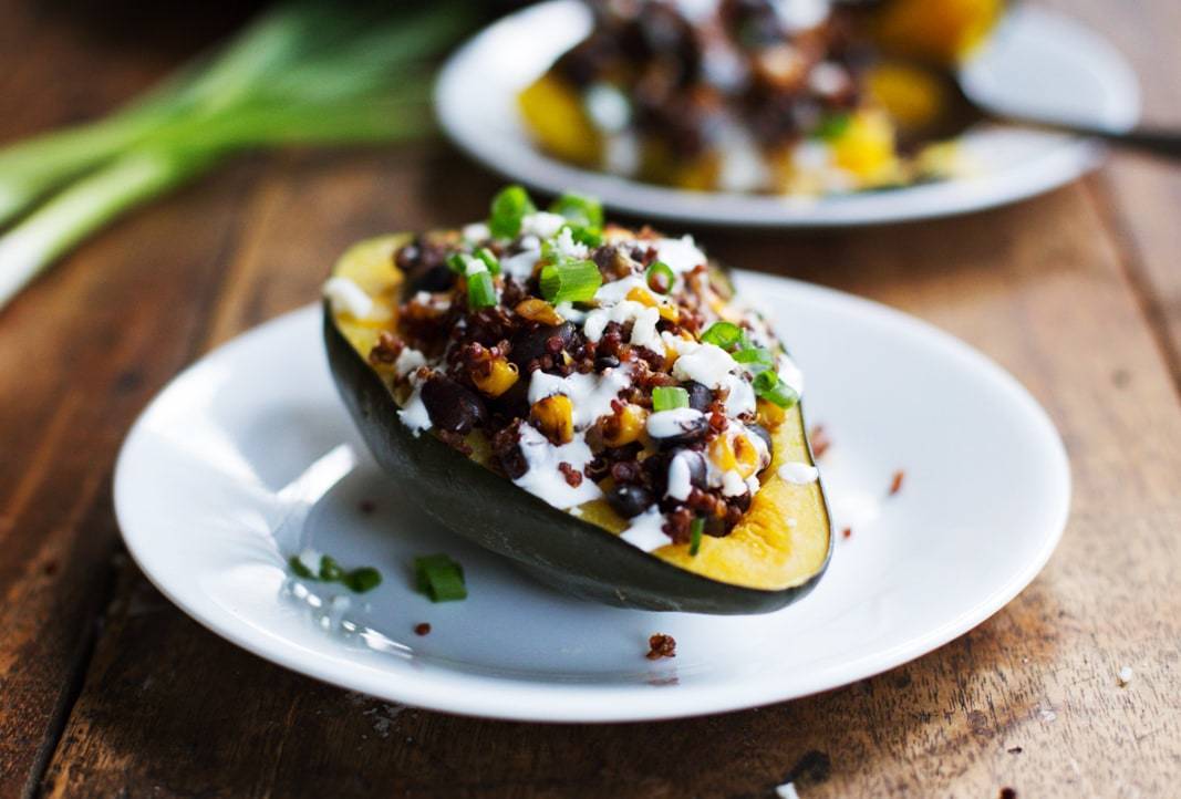 Mexican Roasted Corn and Quinoa Stuffed Squash on a plate.