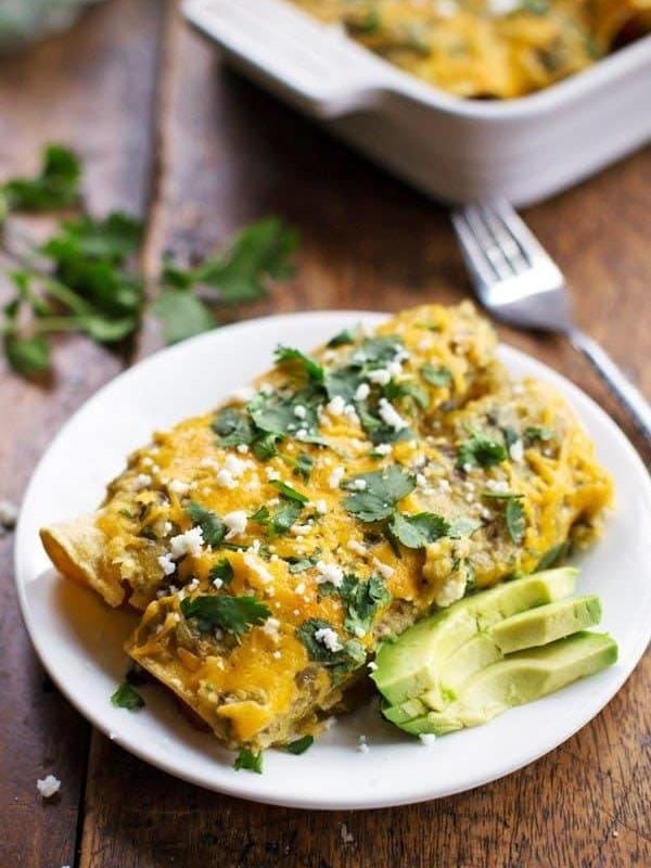 Butternut Squash and Mushroom Enchiladas with Tomatillo Sauce - corn tortillas stuffed with veggies and smothered in homemade sauce and cheese for just 250 calories. YES. | pinchofyum.com