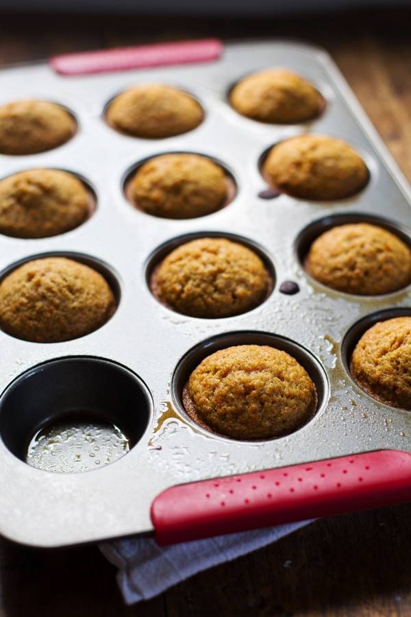 Carrot cake cupcakes in a muffin tin.