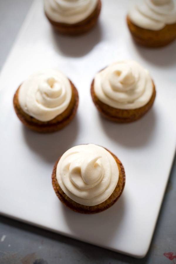 Carrot cake cupcakes with frosting.