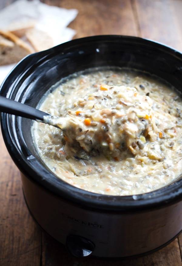 This Crockpot Chicken Wild Rice Soup is so darn simple to make and goes perfectly with a piece of crusty bread on a cold winter night. | pinchofyum.com