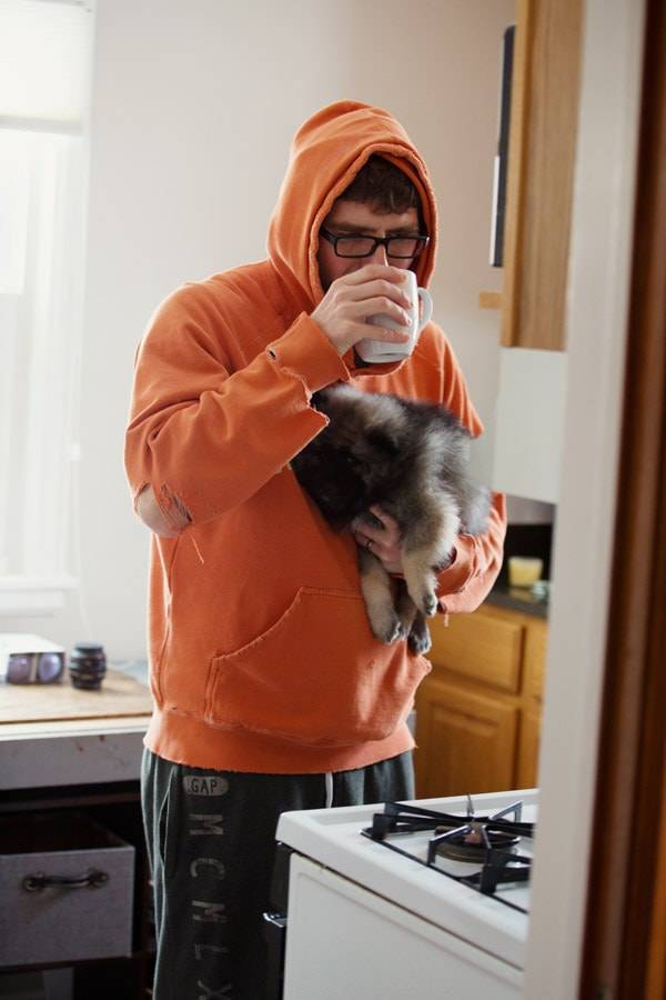 Man holding a puppy.