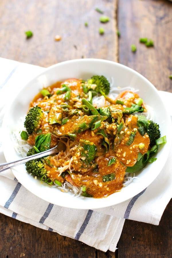 Thai Curry Sauce on veggies in a white bowl.