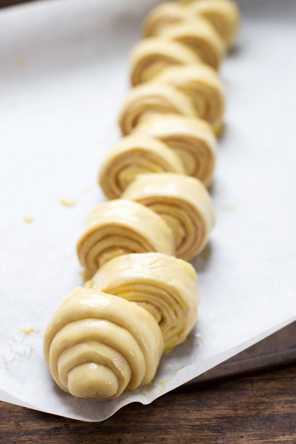 Cinnamon dough on parchment paper.