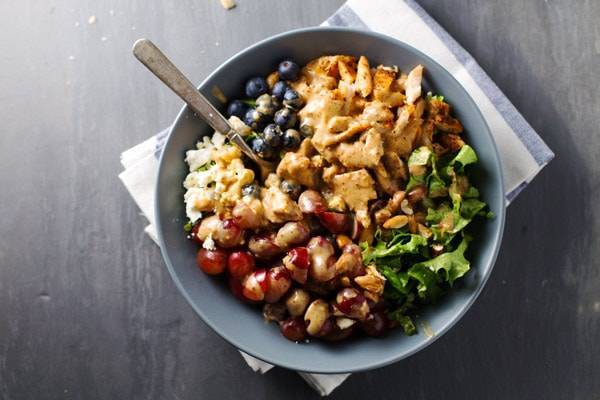 Rainbow Chicken Salad in a bowl with a fork.