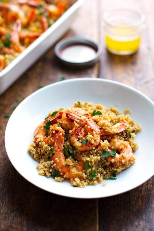 Garlic Butter Shrimp and Quinoa on a white plate.