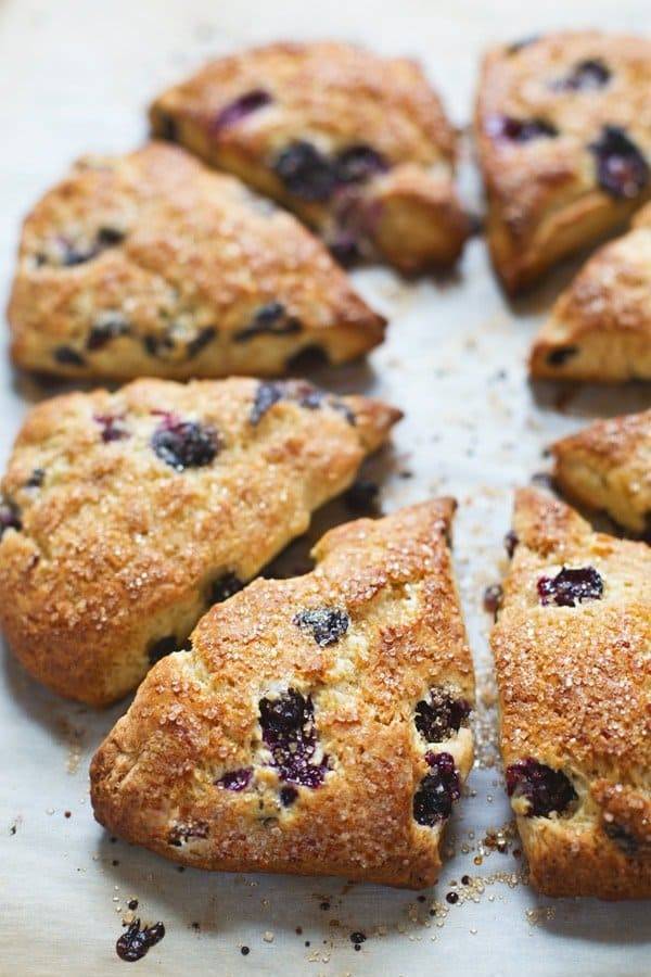 Blueberry Scones on a white surface.