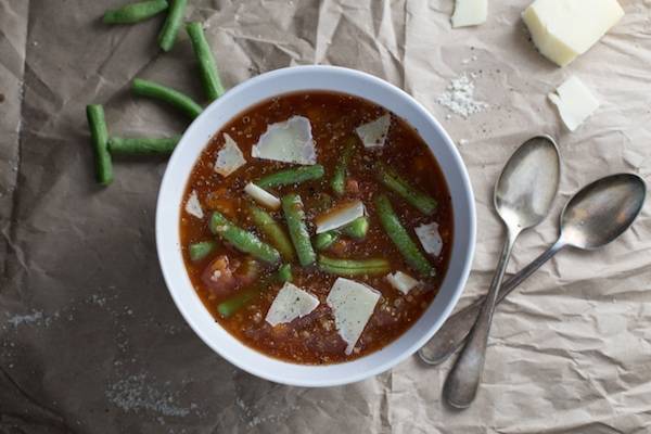 Soup in a bowl with green beans.
