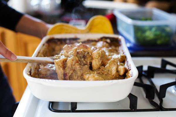 Mixing Chicken Broccoli Quinoa Casserole in a pan.