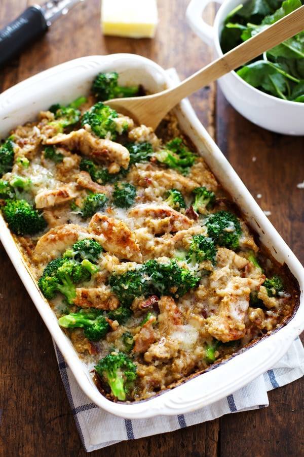 Casserole in a white baking dish with a wooden spoon.