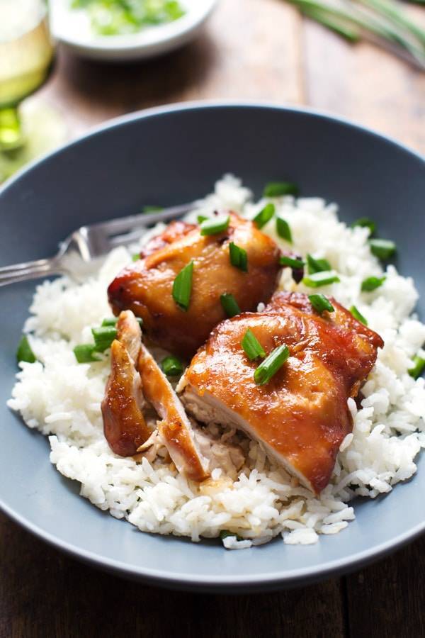 Sticky bourbon chicken with rice in a bowl.