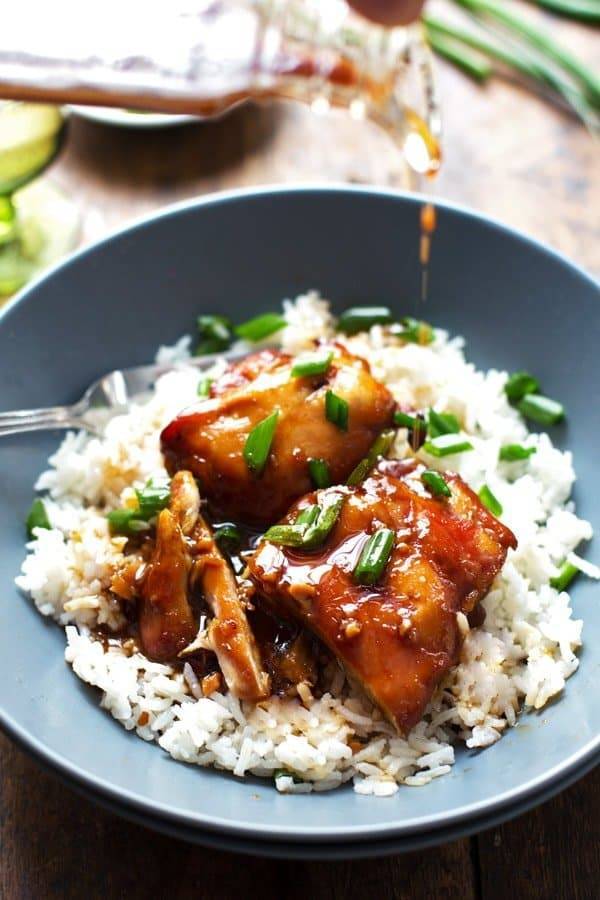 Sticky bourbon chicken with rice in a bowl.