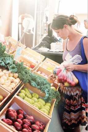 Woman looking at produce.