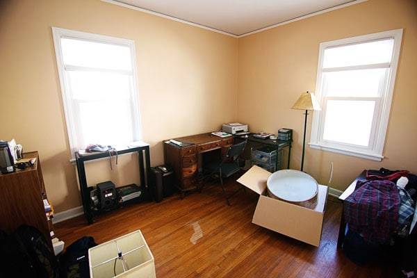 Bedroom with furniture and boxes.
