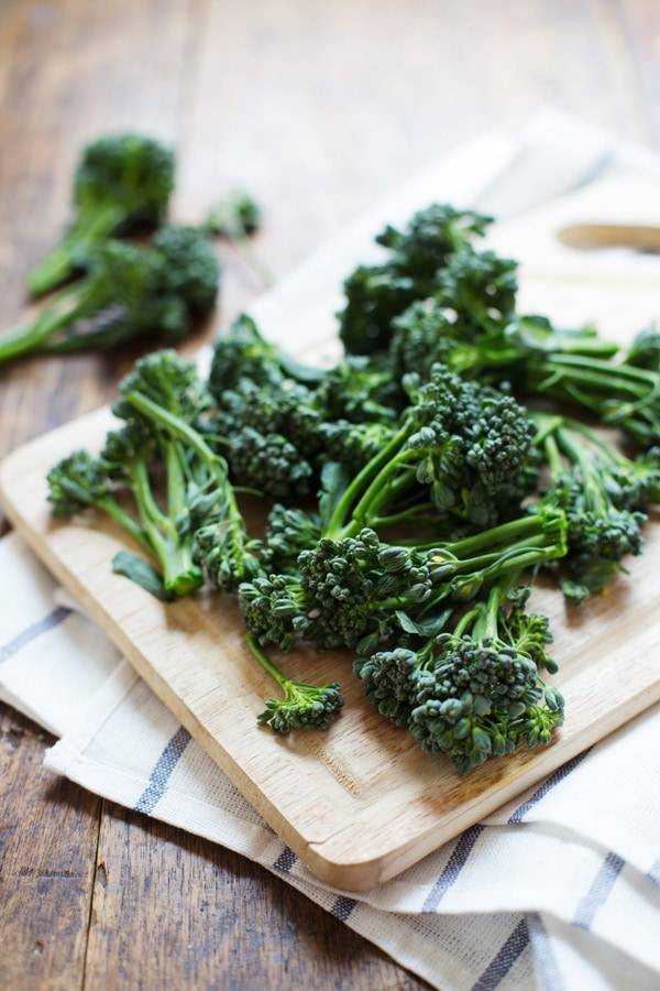 Broccoli on a cutting board.