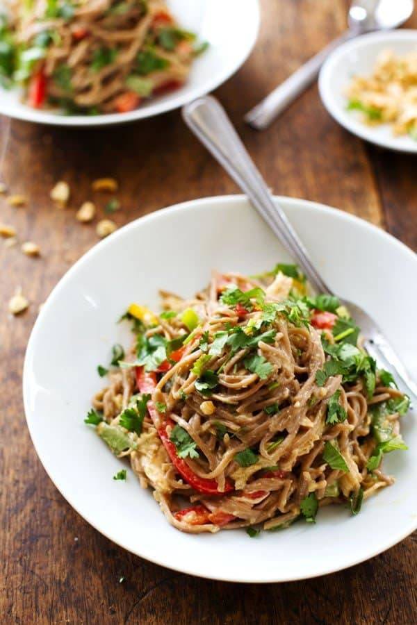 Peanut Chicken Soba Noodle Salad in a white bowl with a fork.