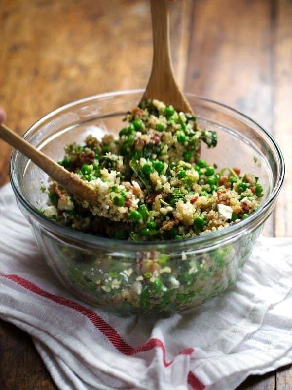 Spring Quinoa Salad with Honey Lemon Vinaigrette - peas, bacon, fresh herbs, almonds. Serve on spinach for fresh take-to-work lunches! | pinchofyum.com