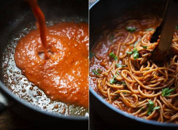 Spaghetti sauce in a pan and mixed with noodles.