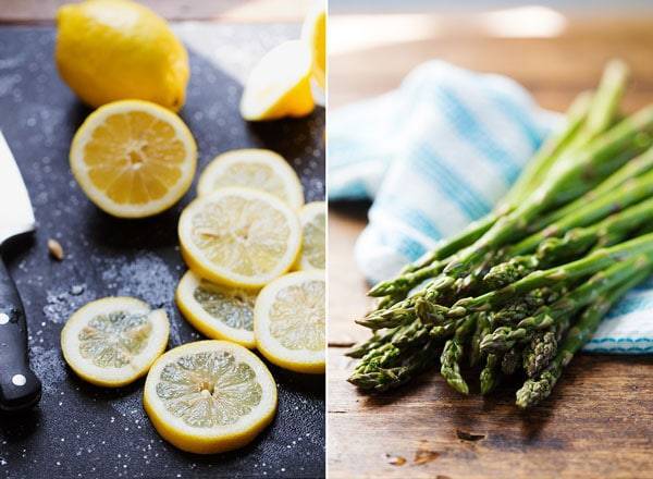 Lemons on a cutting board and asparagus.