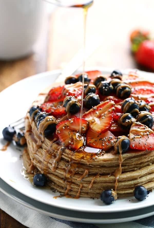 Cinnamon Whole Grain Power Pancakes with berries and drizzle.