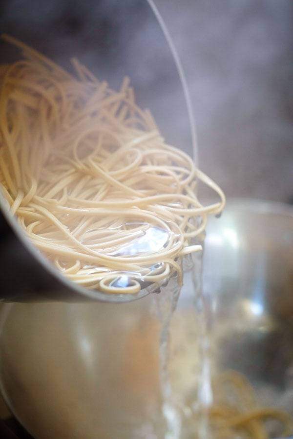 Noodles steaming in a pot.