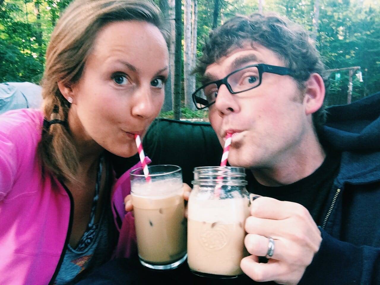 Man and woman drinking iced coffee.
