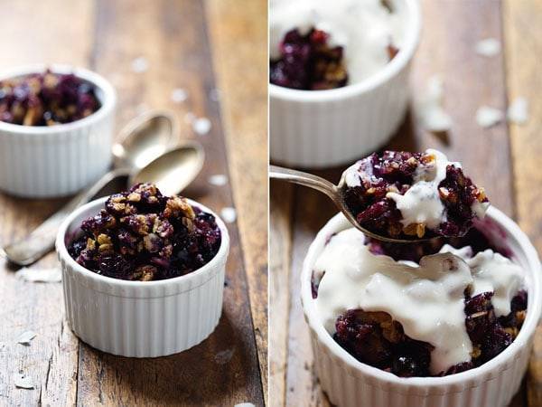 Simple Oat and Blueberry Crisp in small white dishes.