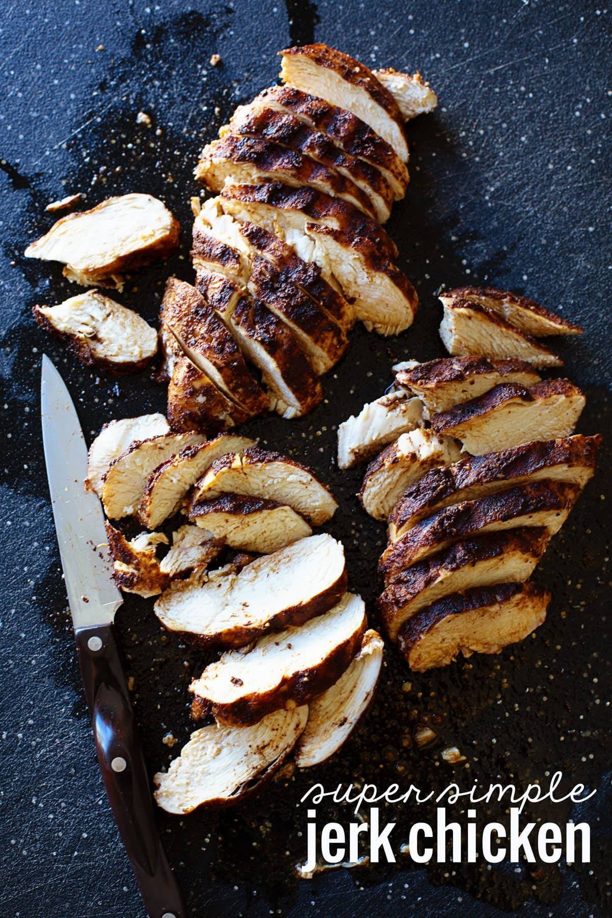 Chicken cut into pieces on a cutting board.