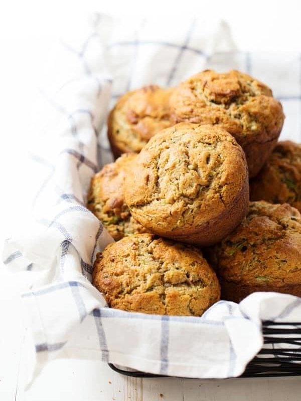 Honey and Olive Oil Zucchini Muffins - hard to believe these sweet, moist, jumbo puffy muffins are healthier with whole wheat, olive oil, and no refined sugar! 280 calories. | pinchofyum.com
