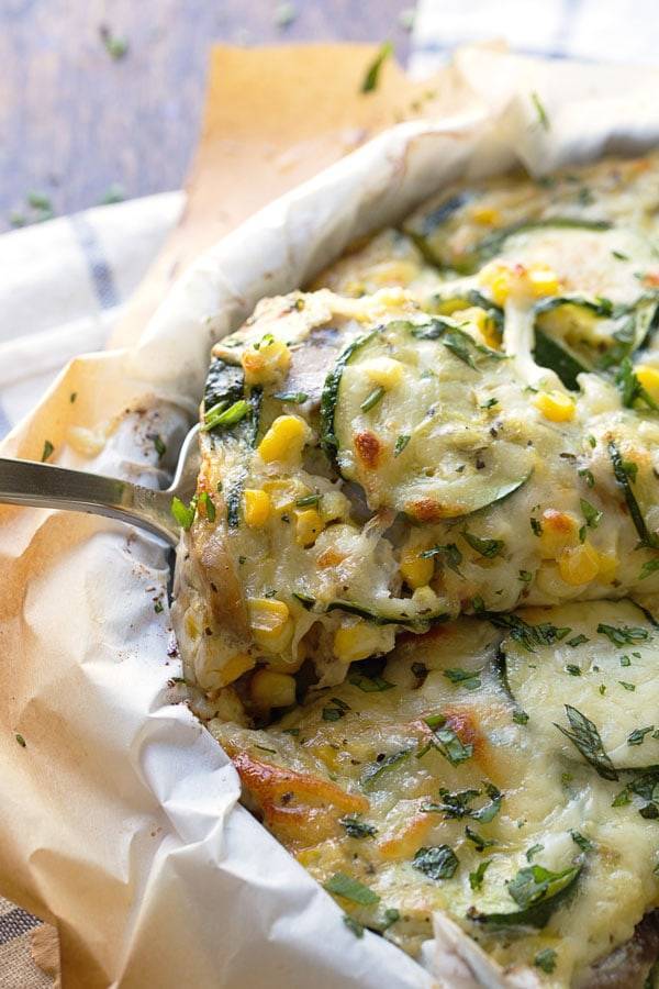 This crustless Sweet Corn and Zucchini Pie is so incredibly simple to make and it's the perfect way to enjoy summer produce! | pinchofyum.com