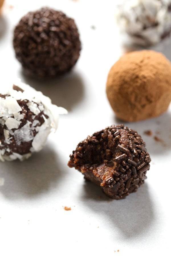 Chocolate truffles on a white surface.