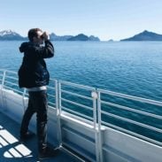 Bjork using binoculars in Alaska.