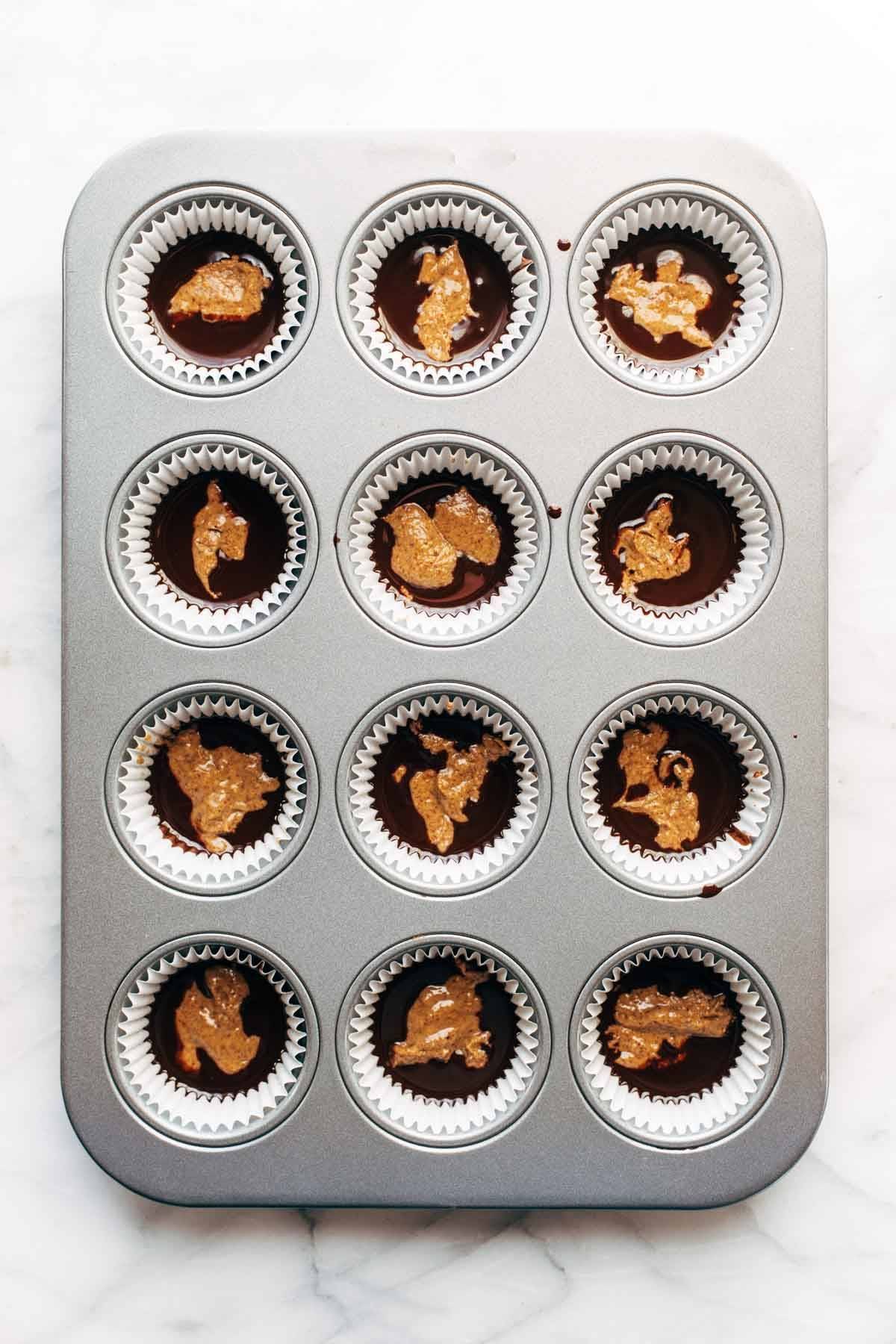 Almond butter cups with chocolate and almond butter.