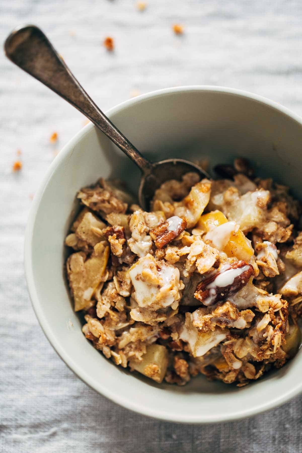Coconut Oil Apple Crisp in a bowl with a spoon.