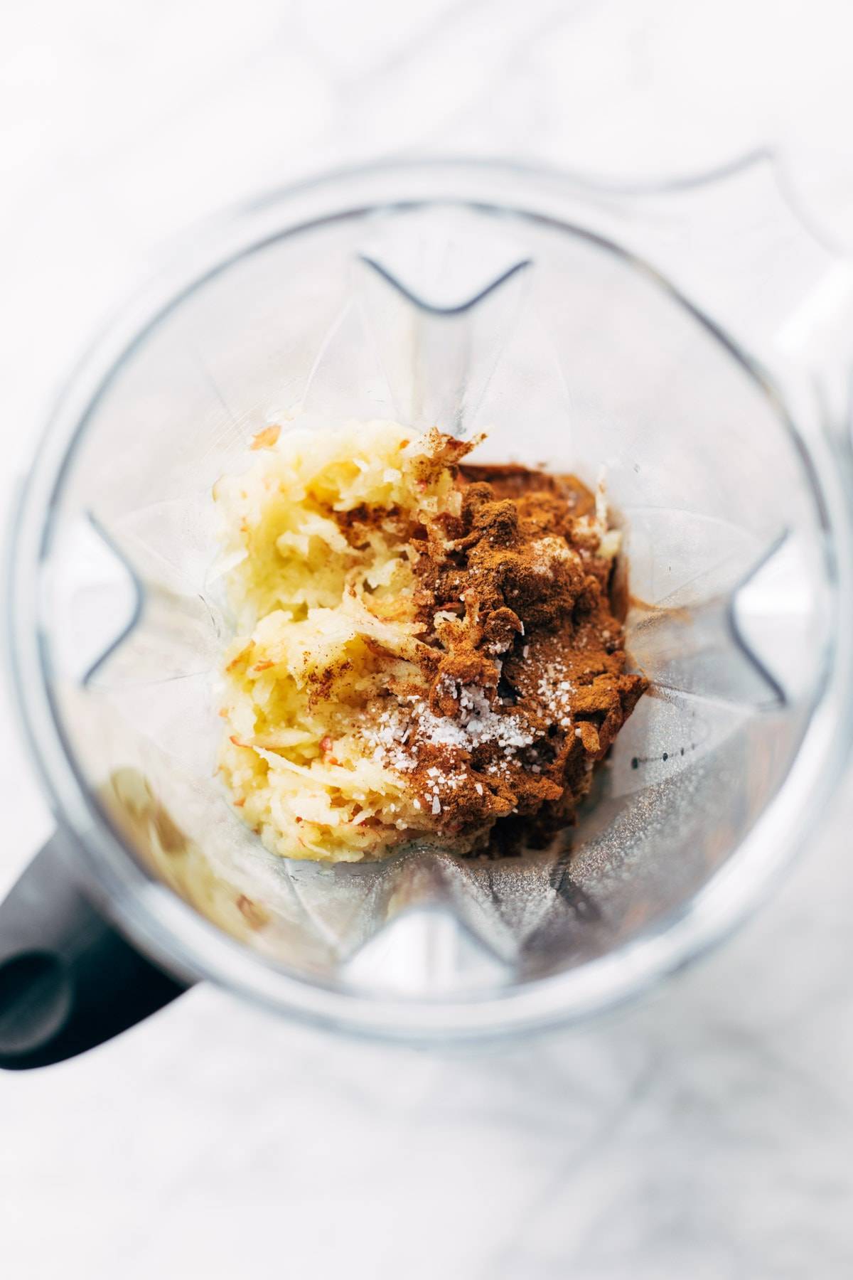 Ingredients for apple muffins in a blender.