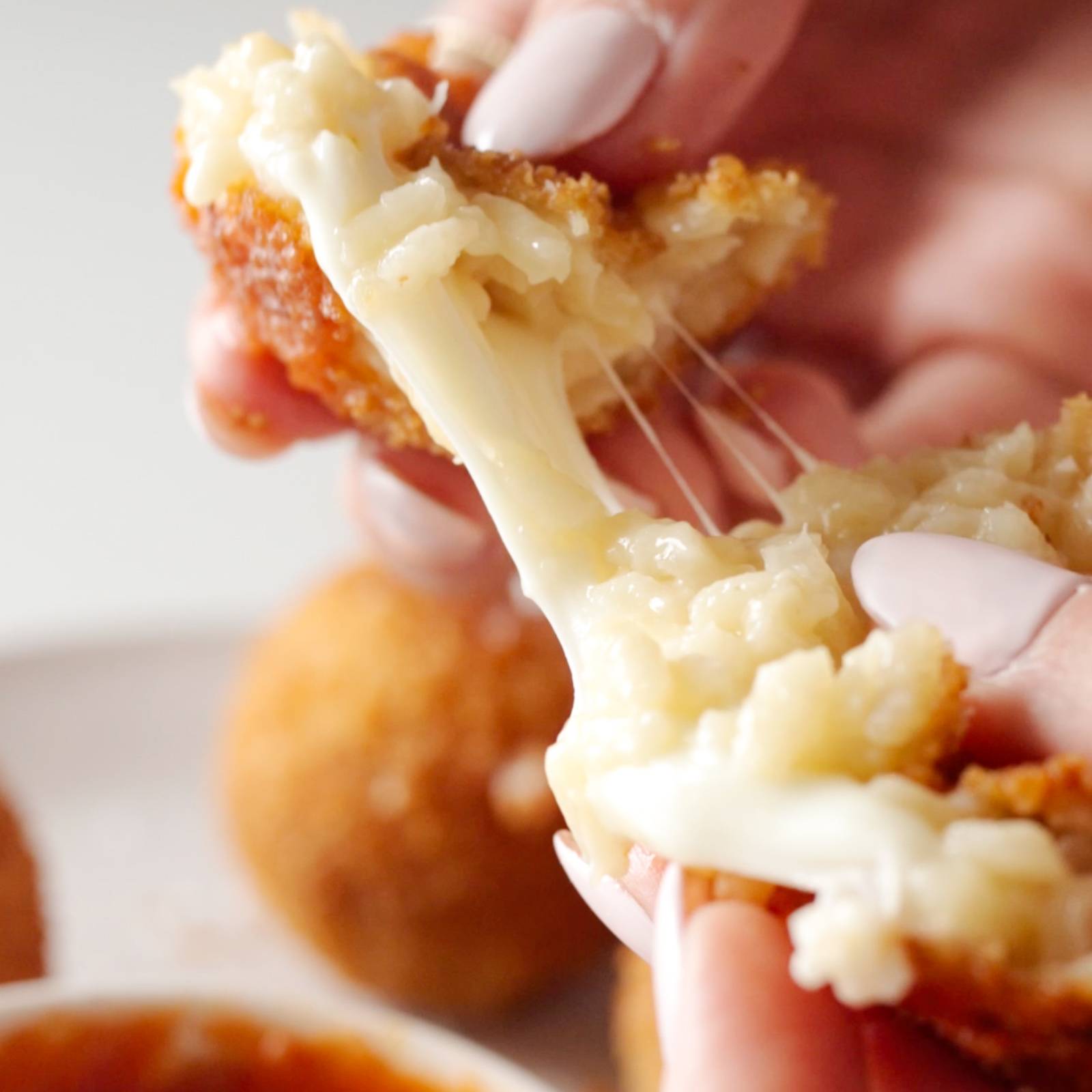 Pulling apart a ball of arancini.