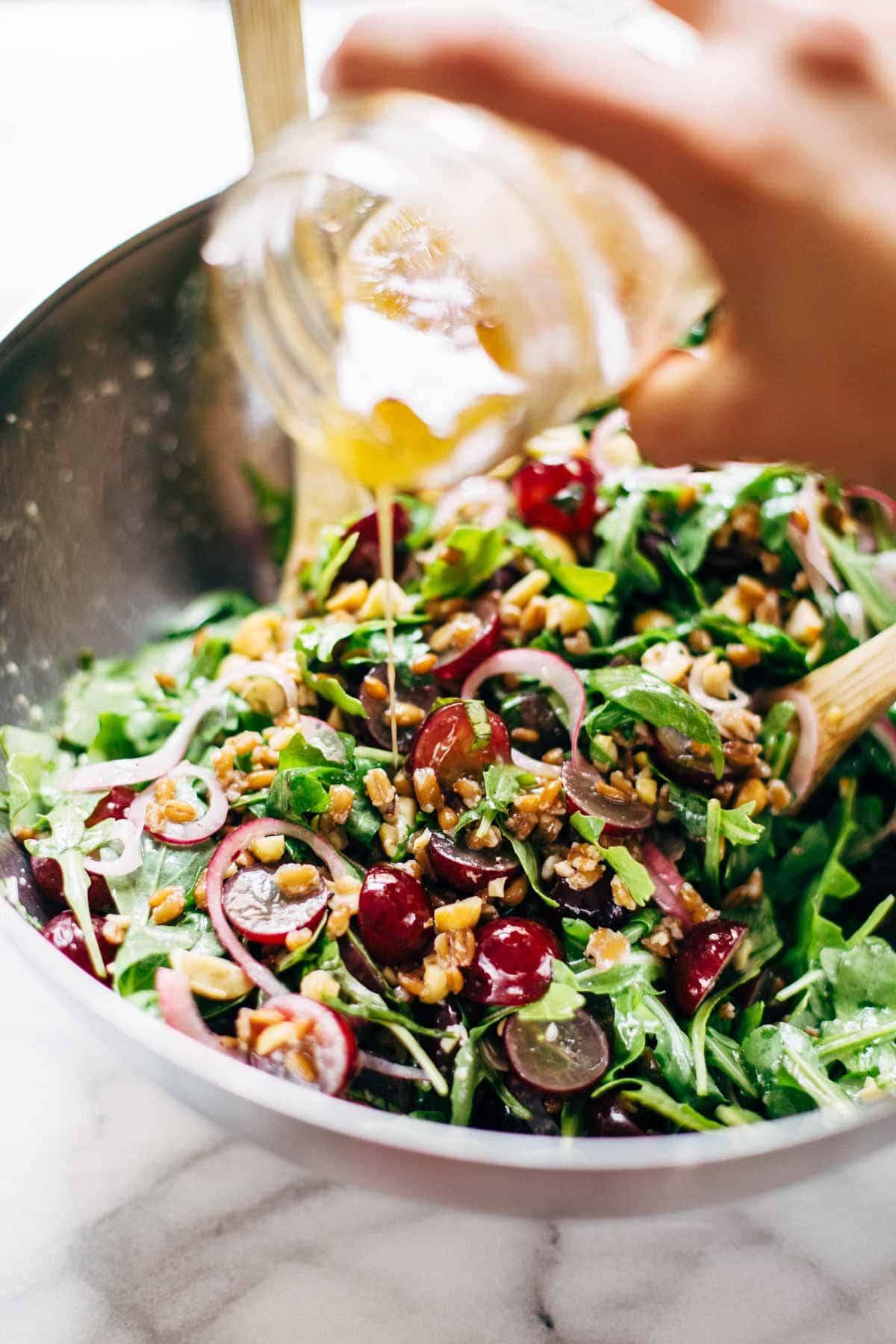 This Arugula Salad has grapes, cashews, pickled red onions, and a simple black pepper vinaigrette. Vegan, vegetarian, gluten free. | pinchofyum.com
